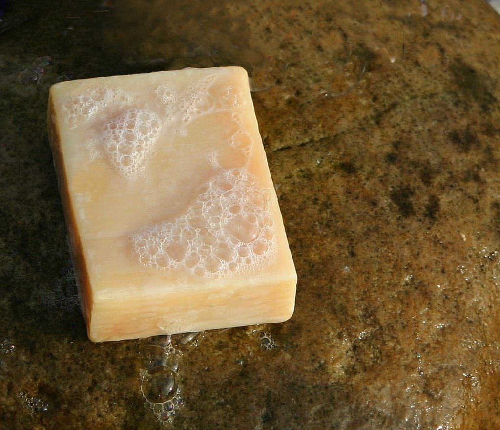 Handmade soap with the extract of stinging nettle (Urtica dioica). On a stone in Malene Thyssen's driveway, Randers in Denmark. Cropped, objects other than soap and stone roughly cloned out. Date 13 July 2005, simplified version 2020-04-26 21:05:28 Source Simplified version of File:Handmade soap.jpg Author Malene Thyssen, simplified by HLHJ